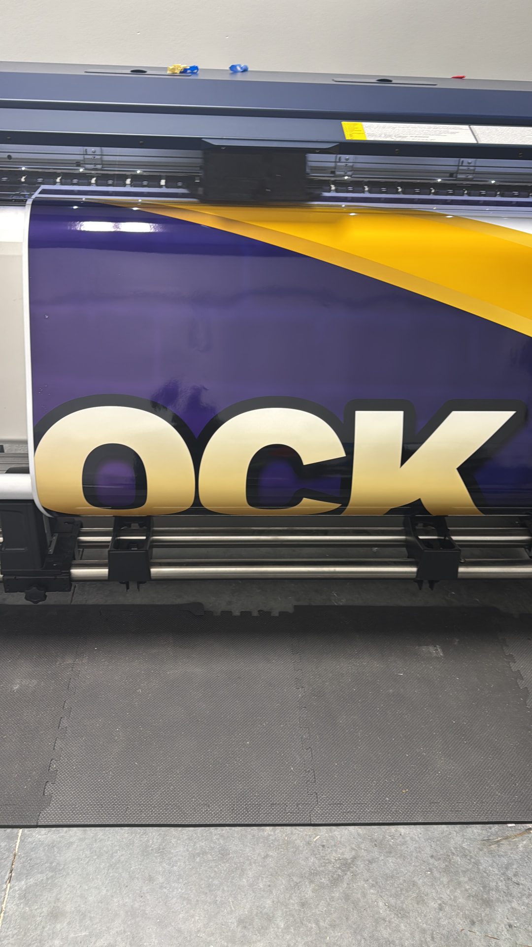 Large-format printer producing wrap graphics in-house