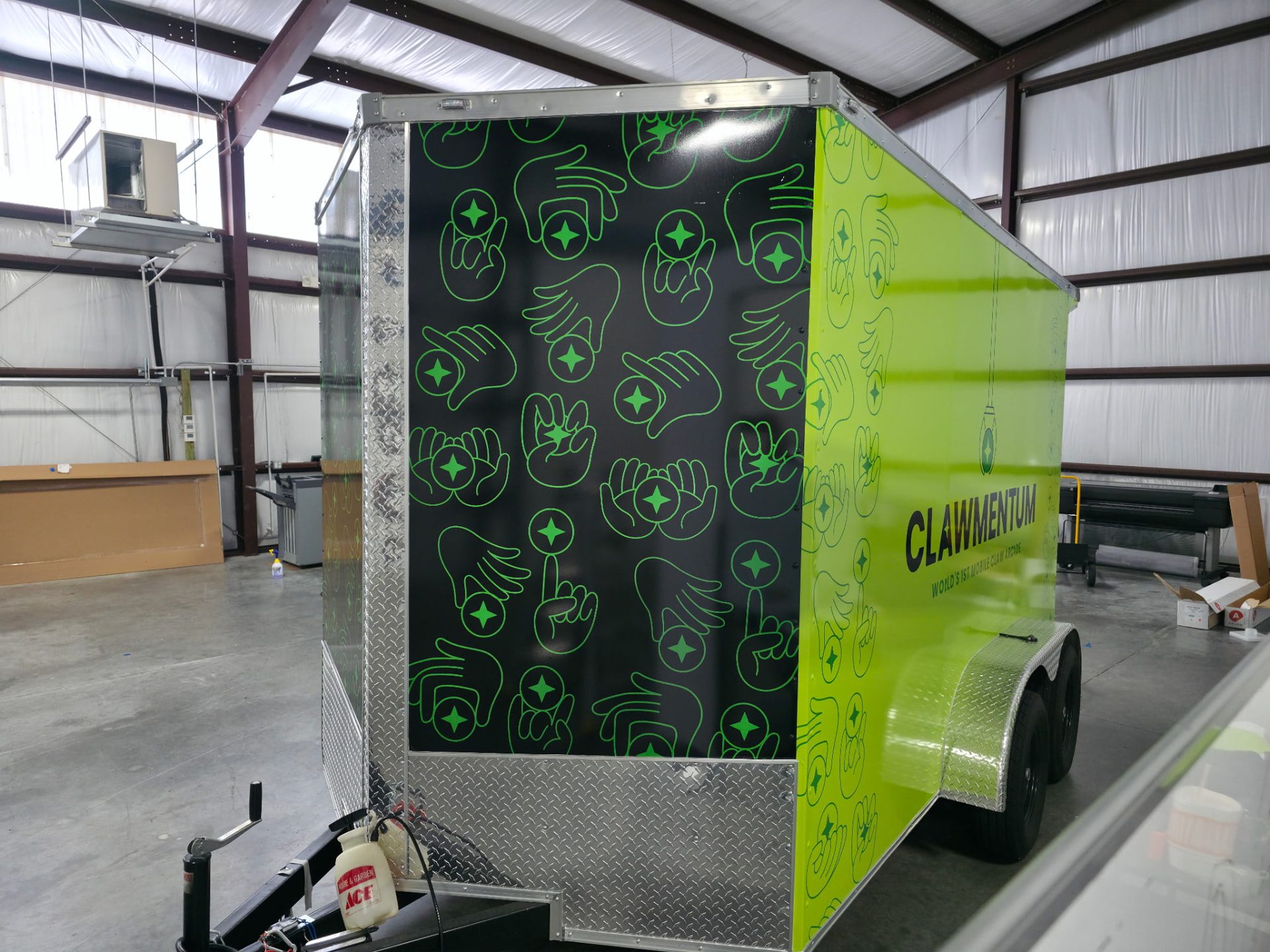 Recently completed enclosed trailer wrap, black and lime green design